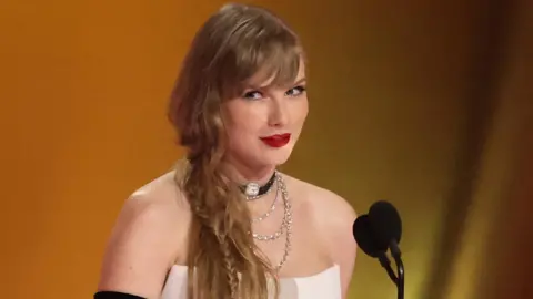 Taylor Swift on stage at the Grammy Awards