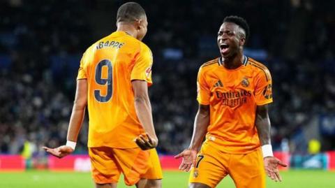 Kylian Mbappe and Vinicius Junior celebrate