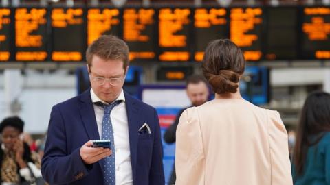 Rail passengers at station