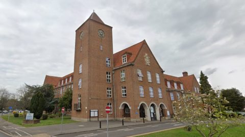 A Google Street image of the council's red-bricked offices with a clock tower.