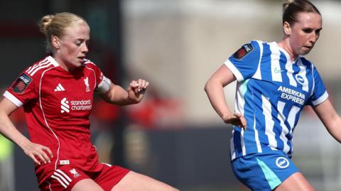 Bex Rayner of Brighton & Hove Albion is challenged by Grace Fisk of Liverpool