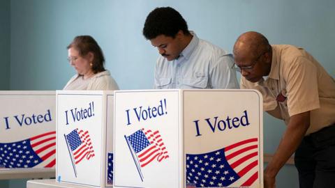 People fill out ballots during early voting at the Garners Ferry Adult Activity Center on 26 May 2026 in Hopkins, South Carolina. 