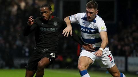 Stoke City's Eric Bocat battles for the ball against Queens Park Rangers' Jimmy Dunne