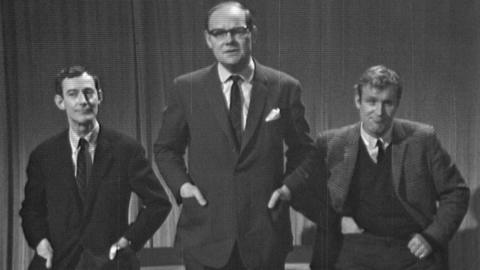 Black and white image of the Tonight presenters with their hands in their pockets