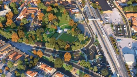 This is an overhead artist's impression of Selby's Station Gateway scheme. It shows the railway lines on the right, with a new station plaza leading into Selby's Victorian park.