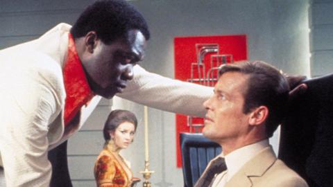 Yaphet Kotto as Dr Kananga giving Roger Moore's James Bond a grilling in Live and Let Die