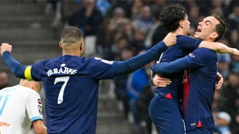 Kylian Mbappe celebrates with his PSG team-mates