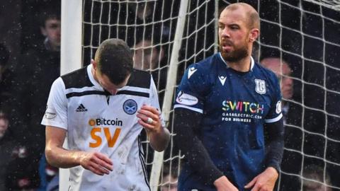 Ayr's Aaron Muirhead (left) misses a second half penalty