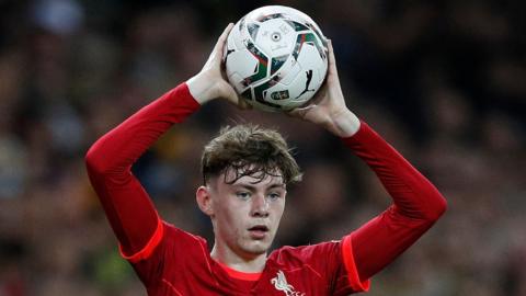 Conor Bradley is about to take a throw-in during his Liverpool debut against Norwich