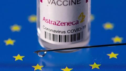 Vial labelled "AstraZeneca coronavirus disease (COVID-19) vaccine" placed on displayed EU flag is seen in this illustration picture