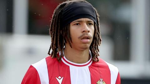 Makai Welch in red and white striped Hornchurch shirt