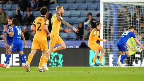 Oli McBurnie celebrates his equaliser at Leicester