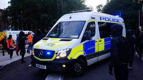 Police patrol in Bristol during an anti immigration protest