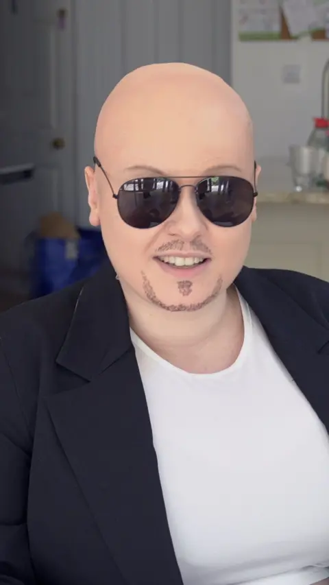 Woman dressed as the singer Pitbull