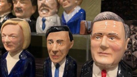 Toby Jugs on a shelf in the Parliament shop depicting Liz Truss, Rishi Sunak and Sir Keir Starmer