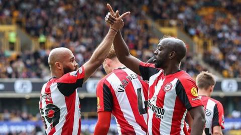Bryan Mbeumo and Yoane Wissa celebrate after the Cameroonian's goal for Brentford at Wolves