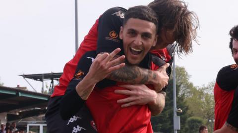 Jaze Kabia celebrates scoring for Truro City