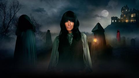 Claudia Winkleman and dark cloaked figures.