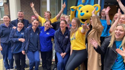 Staff celebrate the news that the hospice was saved
