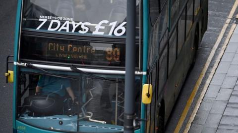A bus advertises £16 weekly fares in Liverpool