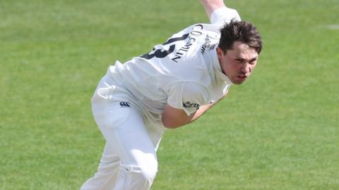 Durham's Paul Coughlin in bowling action