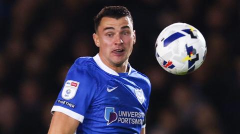 Regan Poole watches a bouncing ball