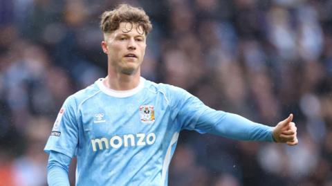 Victor Torp gives a thumbs up to team-mates during a Coventry City game