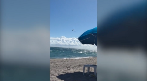 Paraglider falling almost 500ft into the ocean