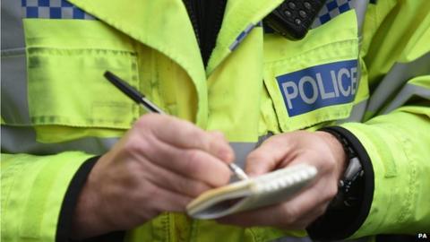 Police officer with notebook