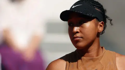 Naomi Osaka looks on