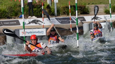 Joe Clarke, Ben Haylett and Jonny Dickson in action in the men's team kayak event.