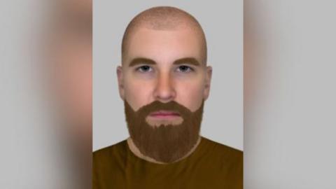 A computer-generated image of a white man wearing a brown jumper. He has a bald head and brown beard and is looking straight into the camera with a neutral expression.