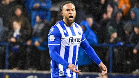 Charles Dunne celebrates