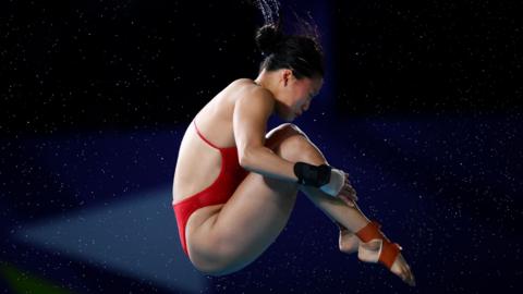 Great Britain's Eden Cheng performs a dive