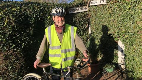 Colin Bedford holding an old bicycle