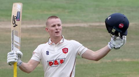 Essex batter Charlie Allison celebrates scoring a century