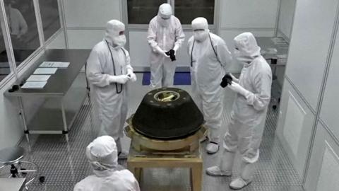 Scientists inspecting capsule holding asteroid Bennu samples