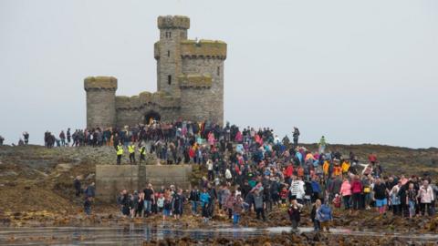 Crowds of people at the Tower of Refuge