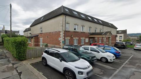 A Google Street View screenshot of the outside of Wyndham Manor care home.