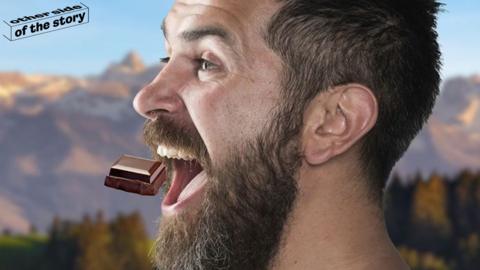 Man trying chunk of dark chocolate