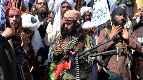 Afghan Taliban militants and villagers attend a gathering as they celebrate the peace deal and their victory in the Afghan conflict on US in Afghanistan, in Alingar district of Laghman Province on March 2, 2020