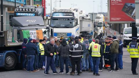 Truck drivers on a bridge in Dublin