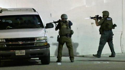 Police check a car in Dallas, Texas - 8 July 2016