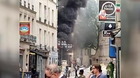 Smoke billowing out of building on Paris street