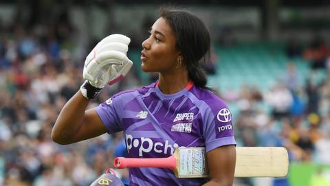 Northern Superchargers batter Davina Perrin blows a kiss as she walks off after hitting a century