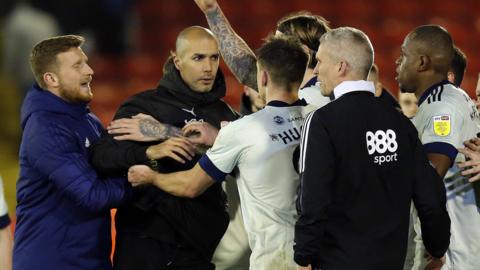 Cardiff and Barnsley players and staff clash