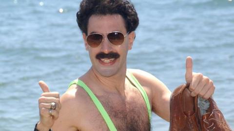 Sacha Baron Cohen as Borat in a mankini with thumbs up