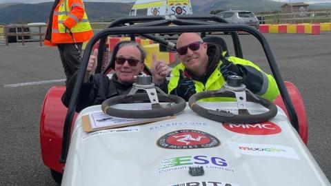 Roger Ingrey and Andy Bevan in a car on the race track