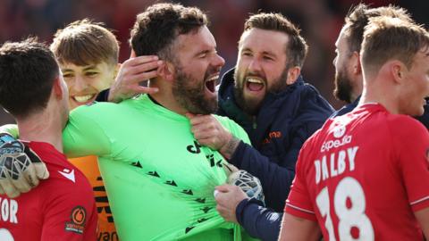 Wrexham goalkeeper Ben Foster celebrates with team mates