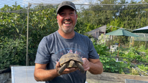 Lawson Pipet holding one of his 57 Tortoises